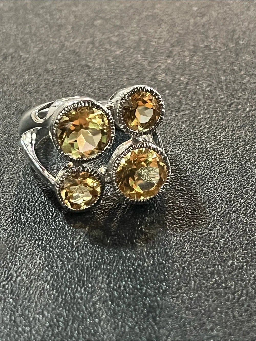 Sterling silver ring w/ 4 citrine gemstones. Sz 7. Pretty, unique design. 925